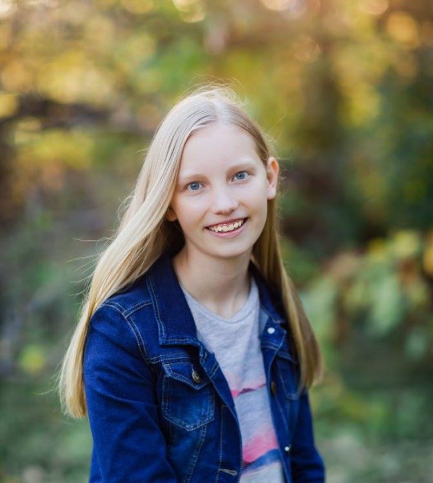 picture of me, the author, in nature surrounded by trees.