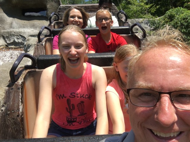 my family and I on a rollercoaster at Dollywood getting soaking wet!