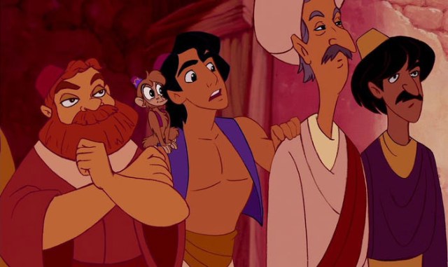 Ron Clements and John Musker next to Aladdin 